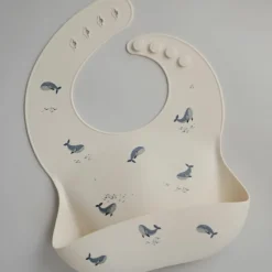 Bavoir à poche en silicone Baleine